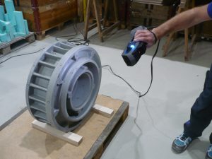 Using the Go!SCAN SPARK to scan an oil chamber casing. The oil chamber casing is on a pallet.
