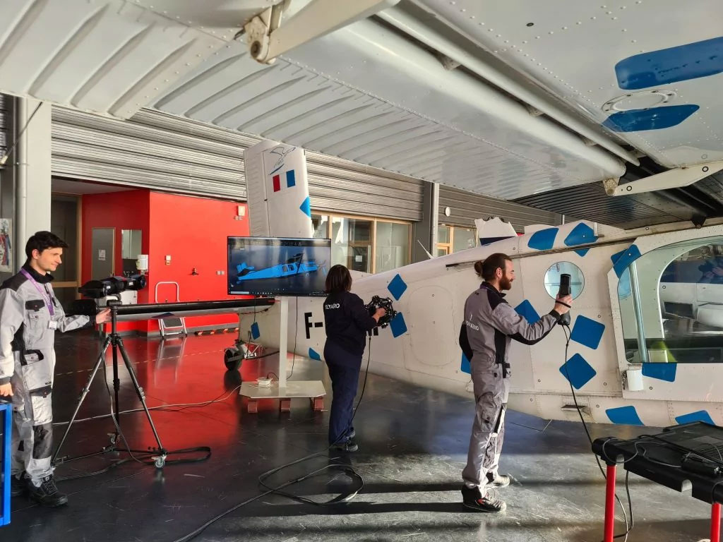 The Polyaero team scanning an aircraft part