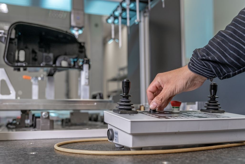 Colse-up of an employee using a traditional CMM