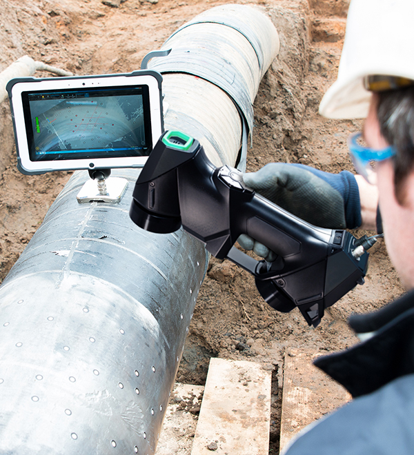 Man scanning a pipe with the HandySCAN 3D BLACK