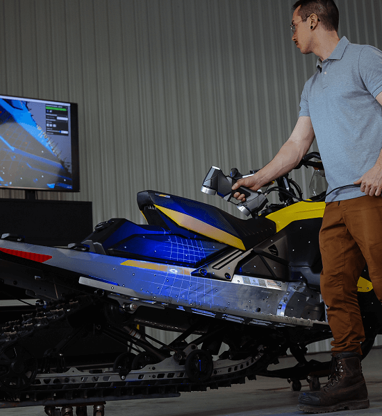 man scanning skidoo with handyscan silver 3d scanner
