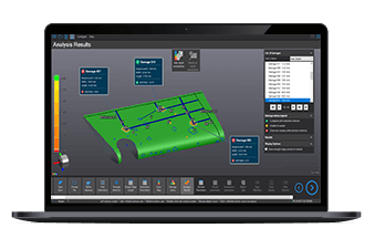 Laptop screen displaying Creaform's 3D software interface, showcasing analysis results of a green surface model with dimensional measurements and annotations.